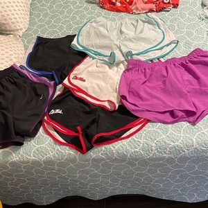 Six pairs of size medium track shorts